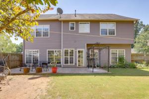 a house with a porch with a swing at 4 Mi to Chattahoochee River Family Home with Yard! in Roswell