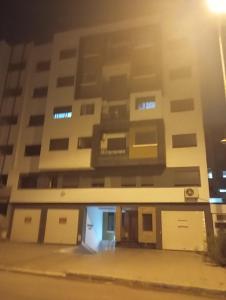 an apartment building at night at للا ربيعة بيتي in Kenitra
