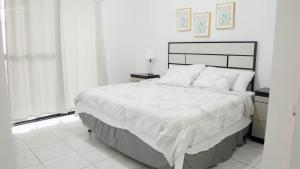 a white bedroom with a large bed and a window at House in San Miguel, Res. San Andres in San Miguel +59 photos
