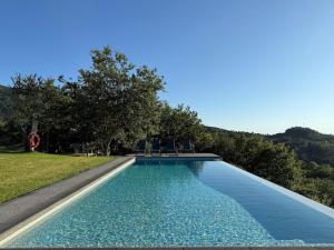 Bazén v ubytování Perral Nature - Casa da Oliveira - Gerês nebo v jeho okolí