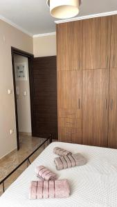 a bedroom with a bed with two towels on it at Anesis home in Gythio