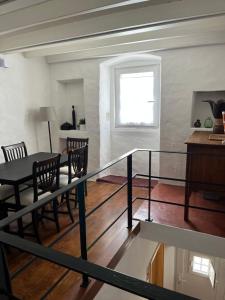 a room with a table and chairs and a window at Casa da Orada in Avis +12 photos