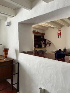 a kitchen with white walls and a counter top at Casa da Orada in Avis