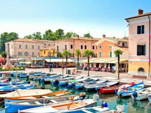 a group of boats are docked in a harbor at Holiday Home Bardolino with Pool near Lake in Bardolino