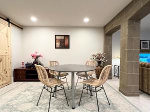 a dining room with a table and chairs at The McCleery Inn in Vancouver