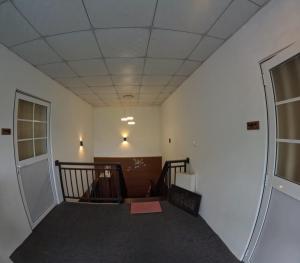 an empty room with a staircase and a door at Villa Rivora in Kitulgala