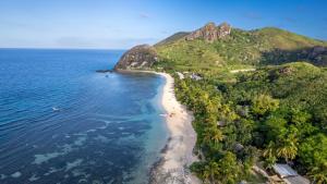 an aerial view of a beach in the ocean at Barefoot Kuata Island Resort in Kuata