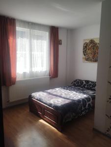 Ένα ή περισσότερα κρεβάτια σε δωμάτιο στο Casa Scurtu 2025