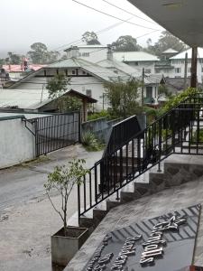 a set of stairs with a potted plant on it at Glenfalls Residencies in Nuwara Eliya