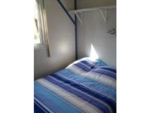 Ένα ή περισσότερα κρεβάτια σε δωμάτιο στο Mobil home avec Terrasse, 4 pers, 2 ch - API-1-52-502 +26 φωτογραφίες