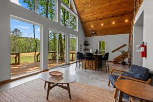 a living room with a table and chairs at LostForest Cabins in Richards