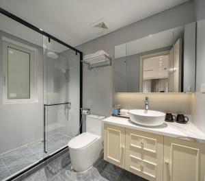 a bathroom with a toilet and a sink and a shower at Jade Boutique Hotel in Hanoi +51 photos