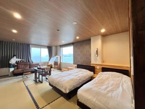 Katil atau katil-katil dalam bilik di 浜辺の宿美波 +22 gambar