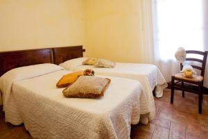 Postel nebo postele na pokoji v ubytování Agriturismo Borgo Vigna Vecchia