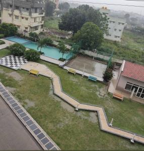 an aerial view of a park with a tennis court at Home Stay 1 BHK Apartment Electronic City -Oakwood in Attibele