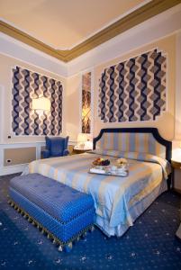 Postel nebo postele na pokoji v ubytování Grand Hotel Nizza Et Suisse