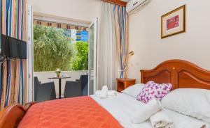 Postel nebo postele na pokoji v ubytování Hotel Dubrovnik