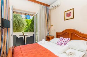Postel nebo postele na pokoji v ubytování Hotel Dubrovnik