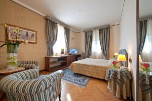 Postel nebo postele na pokoji v ubytování Grand Hotel Nizza Et Suisse