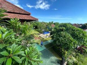 an overhead view of a person standing in front of a house at Tulamben Wreck Divers Resort & Restaurant in Tulamben