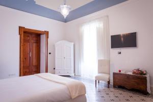 Posteľ alebo postele v izbe v ubytovaní Palazzo Montalbano