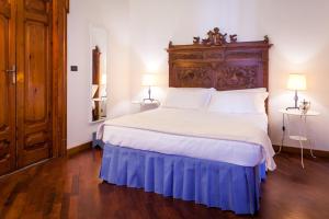 Posteľ alebo postele v izbe v ubytovaní Palazzo Montalbano