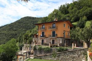a house on the side of a mountain at Fenil Del Santo in Tremosine Sul Garda