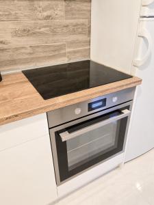 Kuchyň nebo kuchyňský kout v ubytování High White apartments 2 NEW