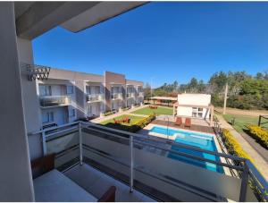 a view from the balcony of a building with a swimming pool at Resort Termal Chajarí in Chajarí