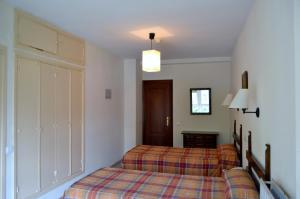 Posteľ alebo postele v izbe v ubytovaní Hotel Termas de Liérganes