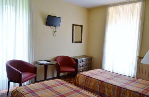 Postel nebo postele na pokoji v ubytování Hotel Termas de Liérganes + 29 fotografií