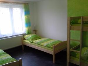 Postel nebo postele na pokoji v ubytování Apartmán Hastrmánek, Kvilda 3