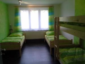 Postel nebo postele na pokoji v ubytování Apartmán Hastrmánek, Kvilda 3