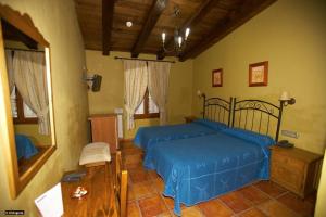 Postel nebo postele na pokoji v ubytování Hotel Enrique Calvillo
