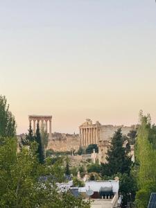 a view of the acropolis of athens from the city at Sukoun Studios in Baalbeck