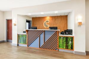 an office lobby with a reception desk with a crescent moon on the wall at Comfort Inn Emporia in Emporia