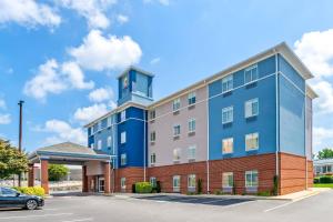 a building with a clock tower on top of it at Comfort Inn Emporia in Emporia