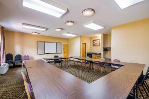a conference room with wooden tables and chairs at Quality Inn Fredericksburg-Central Park Area in Fredericksburg +53 photos