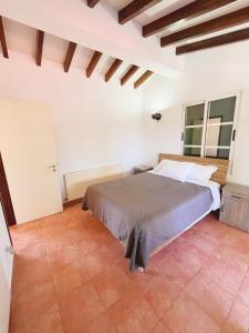 a bedroom with a bed in a white room at Niki villa in Pano Akourdalia +19 photos