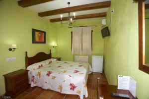 Postel nebo postele na pokoji v ubytování Hotel Enrique Calvillo