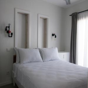 Postel nebo postele na pokoji v ubytování Sakula Hotel