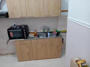 Η κουζίνα ή μικρή κουζίνα στο Larry house