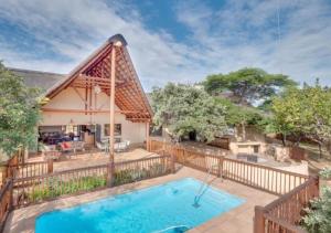 an image of a house with a swimming pool at 205 Zebula, 4 bedroom house in Warmbaths