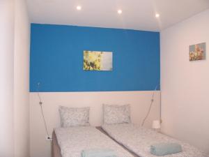 Postel nebo postele na pokoji v ubytování Budapest Trinity Homes