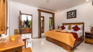 Ένα ή περισσότερα κρεβάτια σε δωμάτιο στο JP House Ubud