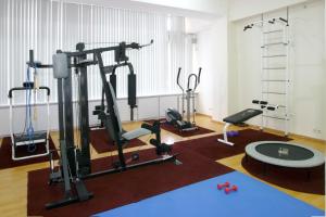 a room with a gym with several tread machines at Otrar in Almaty