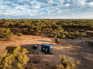 an overhead view of a box in the middle of a field at Lovely Tiny House with Barbecue in Maiden Gully, Victoria in Woodvale +1 photo