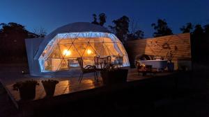a large dome tent with lights in it at night at Bespoke Dome Perfect for a Couples Getaway in Tasmania in Sidmouth
