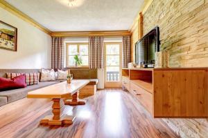a living room with a couch and a table at Bocks Apartments 61 in Wald am Arlberg