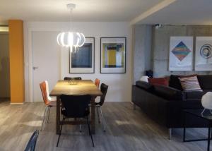 a living room with a table and a couch at Casa Cotera in Sierra
